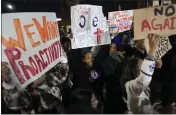  ?? JOHN LOCHER — THE ASSOCIATED PRESS ?? People a chant during a protest against police violence Friday in Las Vegas.