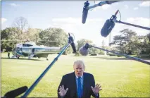  ?? SARAH SILBIGER / THE NEW YORK TIMES ?? President Donald Trump speaks to the media outside the White House. Trump has a history of attacking women and mocking their bodily functions, demeaning their looks or comparing them to animals.