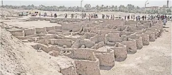  ?? — AFP photo ?? A view of a 3,000 year old city, dubbed The Rise of Aten, dating to the reign of Amenhotep III, uncovered by the Egyptian mission near Luxor.