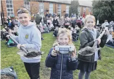  ??  ?? St Patrick’s RC Primary School children prepare to bury the new capsule.