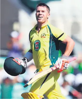  ?? Picture: AFP ?? TON MAN. Australia’s David Warner runs through for the single that brought him his century against Pakistan yesterday.