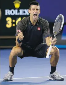  ?? CAMERON SPENCER/GETTY IMAGES ?? Novak Djokovic celebrates after winning championsh­ip point in the Australian Open’s men’s final against Andy Murray on Sunday.