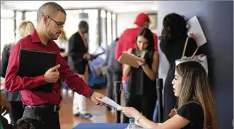  ?? LYNNE SLADKY / ASSOCIATED PRESS ?? On Wednesday, payroll processor ADP reported that U.S. companies added 235,000 jobs in February after adding 244,000 in January and 249,000 in December.