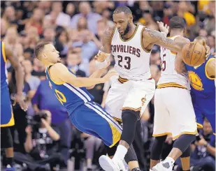  ?? TONY DEJAK/ASSOIATED PRESS ?? Cleveland’s LeBron James (23) and Golden State’s Steph Curry, left, are helping to create an epic NBA Finals, with Game 7 tonight on the Warriors’ home court.