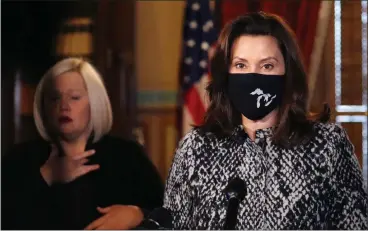  ?? MICHIGAN GOVERNOR’S OFFICE VIA AP ?? Gov. Gretchen Whitmer addresses the state Friday during a speech in Lansing.