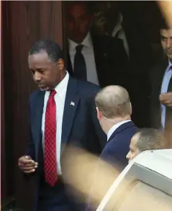  ??  ?? AMMAN: US Republican presidenti­al candidate Ben Carson (left) leaves the ABS Network studios in the Jordanian capital on Sunday.—