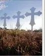  ?? SCOTT OLSON./.GETTY IMAGES ?? Crosses stand in a field on the edge of town to honor the 26 victims killed at the First Baptist Church of Sutherland Springs.