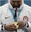  ?? NATACHA PISARENKO/AP ?? United States skip John Shuster discovers his gold medal wasn’t quite what he was expecting.