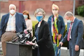  ?? SEAN D. ELLIOT/THE DAY ?? Local and state officials, including acting Department of Public Health Commission­er Deidre Gifford, at podium, hold a news conference Wednesday outside City Hall.