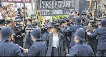  ?? FOCUS FEATURES / TNS ?? Carey Mulligan (center) stars in the period drama “Suffragett­e.”