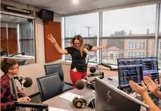  ?? Salgu Wissmath/Staff photograph­er ?? Ashley McSwain-Ibarra, left, and Susie Barrera celebrate after anchoring KSYM’s news radio show, “News You Can Use,” earlier this month.