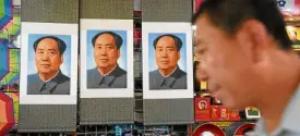  ?? AFP ?? STORE at Beijing’s Tiananmen Square displays old posters of Mao Zedong—”a great leader who made gross mistakes.”