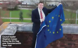  ?? ?? Council leader Stephen Cowan flying the EU flag over Hammersmit­h Town Hall