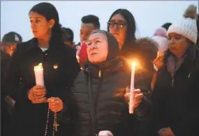  ?? Tyler Sizemore / Hearst Connecticu­t Media ?? Friends and family grieve for homicide victim Valerie Reyes during a candleight vigil in her honor at Glen Island Park in New Rochelle, N.Y. on Feb. 7.