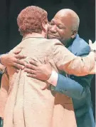  ?? PHIL MASTURZO/AKRON BEACON JOURNAL ?? Omar Banks hugs Summit County Executive Eileen Shapiro after her speech nominating him to be reelected second vice chair of the Summit County Democratic Party on Wednesday at North High School in Akron.