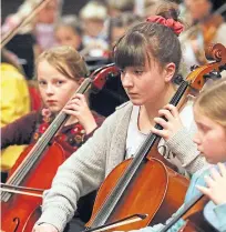  ??  ?? Top: Nicola Benedetti, centre, playing at the Caird Hall; above: Budding musicians from all over Scotland took part in the Dundee event.