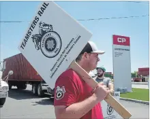  ?? RYAN REMIORZ THE CANADIAN PRESS ?? Canadian Pacific Railway workers picket at the company’s intermodal terminal Wednesday in Montreal. A deal was reached hours later.