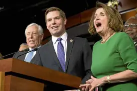  ?? —AP ?? Democrats, led by House Minority Leader Nancy Pelosi (right), celebrate the collapse of Republican efforts to repeal Obamacare.