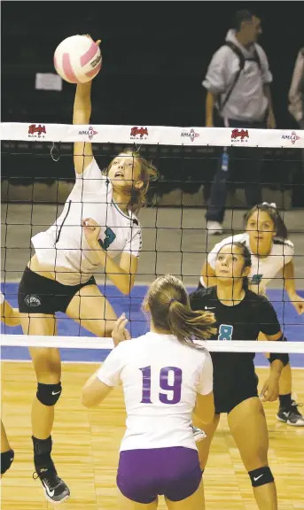  ?? JANE PHILLIPS/FOR THE NEW MEXICAN ?? Capital’s Ishara Sorensen, left, returns a volley to Kirkland Central’s Kambree Pierro, front, Thursday during a volleyball Class 5A State Tournament first-round match at the Santa Ana Star Center. Capital finished third in pool play and was swept by...