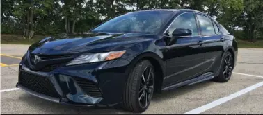  ?? (Robert Duffer/Chicago Tribune/TNS) ?? 2018 Toyota Camry XSE features 19-inch black wheels standard, larger front air intakes, a split X-wing grille, and has a two-inch longer wheelbase and one-inch lower ride height for improved handling and sportier appearance. Pictured at Arlington Park...