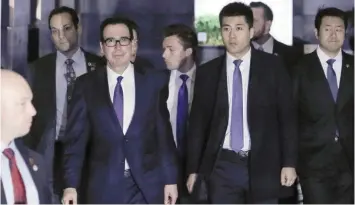  ?? — Reuters ?? US Treasury Secretary Steven Mnuchin, a member of the US trade delegation to China, leaves a hotel in Beijing for talks with Chinese officials, China.