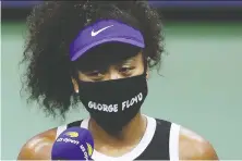  ?? MATTHEW STOCKMAN/GETTY IMAGES ?? Naomi Osaka wears one of her seven masks bearing the names of Black victims of violence.