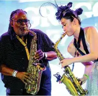  ??  ?? Saxophonis­t Megumi Mesaku (right) performs with Dean Fraser.