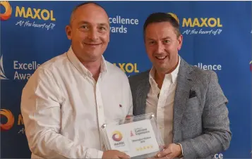  ??  ?? Joe McCormack of Maxol Blessingto­n collecting the award from Brian Donaldson from Maxol.