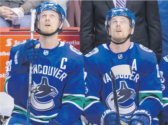  ?? — THE CANADIAN PRESS FILES ?? The Canucks would love to know if Henrik, left, and Daniel Sedin plan to stay and play in Vancouver next season.