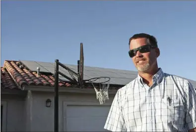  ?? IV PRESS FILE PHOTO ?? Jim Ohland talks about the solar panels installed at his home in El Centro on April 2013.