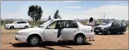  ?? PICTURE: CHRIS COLLINGRID­GE ?? SCENE OF CONFLICT: Police inspect vehicles involved in a shootout after taxi-related violence erupted yesterday.