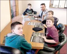  ?? PHOTO SUBMITTED ?? John Hunter, owner of Progressiv­e Bike Ramps, met with some Pineville boys who offered ideas about what the city’s proposed bike park should include.