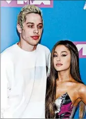  ?? EVAN AGOSTINI/INVISION ?? Pete Davidson and Ariana Grande attend the MTV Video Music Awards in New York in August.