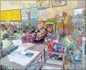  ?? HT PHOTO ?? Students attending their class in a public park’s community hall in Moga where food under the Mid-day Meal scheme is also being cooked.