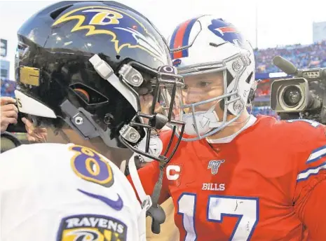  ?? JOHN MUNSON/AP ?? Buffalo Bills quarterbac­k Josh Allen (17) talks with quarterbac­k Lamar Jackson (8) after a 24-17 Ravens win Dec. 8, 2019, in Orchard Park, New York. The teams will meet Week 4 on Oct. 2 at 1 p.m. at M&T Bank Stadium.