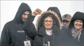  ??  ?? Family members of victims of the Tree of Life synagogue shooting react to a speaker during the Rally for Peace and Tree of Life Victims.