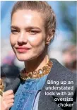  ?? ?? Bling up an understate­d look with an oversize choker