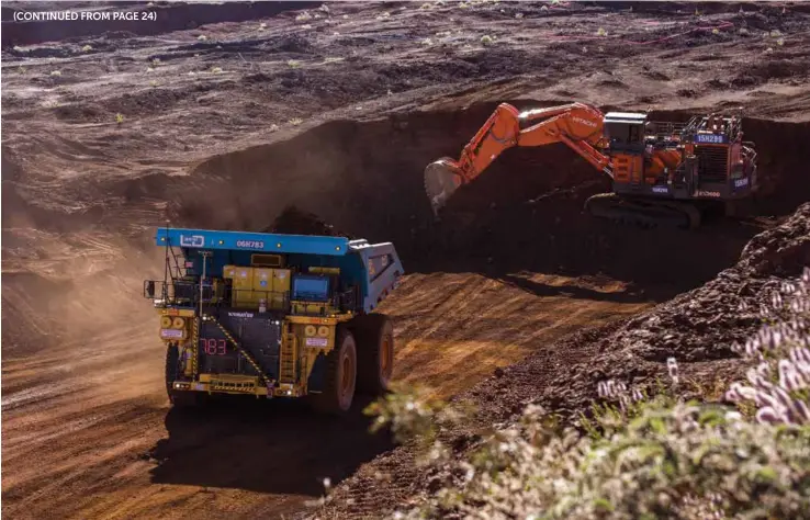  ??  ?? Part of Rio Tinto’s fleet of autonomous haul trucks in the Pilbara.