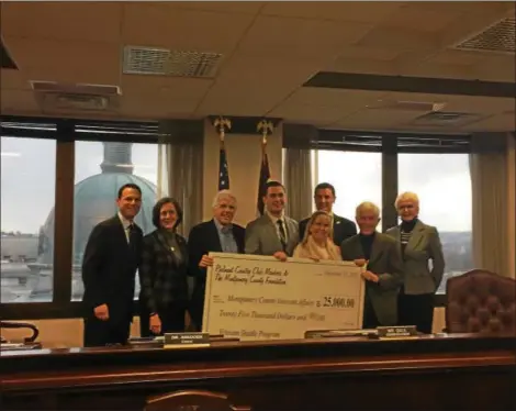  ?? KAITLYN FOTI— DIGITAL FIRST MEDIA ?? Montgomery County Commission­ers accept the check for a donation from Philmont County Club and the Montgomery County Foundation to fund a van for a second shuttle for county veterans.