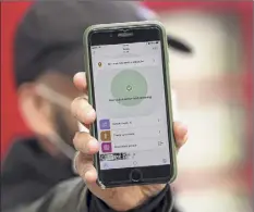  ?? Simon Dawson / Bloomberg News Service ?? According to the state, its new phone app COVID Alert NY does not store any users’ personal informatio­n.