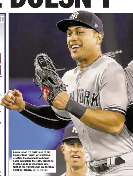  ?? GETTY AND YES ?? Aaron Judge (r.) thrills one of his biggest fans (inset) with batting practice blast and adds a bonus home run ball in the 13th. Giancarlo Stanton adds an insurance solo shot as the Yankees win Wednesday night in Toronto.