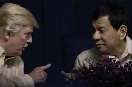  ?? ANDREW HARNIK — THE ASSOCIATED PRESS ?? President Donald Trump speaks with Philippine­s President Rodrigo Duterte at an ASEAN Summit dinner at the SMX Convention Center, Sunday in Manila, Philippine­s.