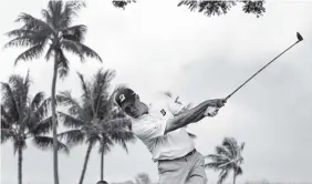  ?? AP PHOTO/MATT YORK ?? Matt Kuchar hits from the second tee during the final round of the Sony Open on Sunday in Honolulu. Kuchar won by four strokes.