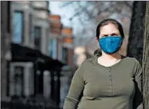  ?? ANTONIO PEREZ/CHICAGO TRIBUNE ?? Erin Vickers stands outside her Chicago home Thursday. Vickers decided not to fly to see family in Virginia for the holiday.