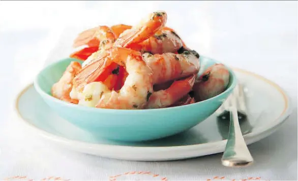  ??  ?? The spot prawns recipe from the book British Columbia from Scratch uses a simple touch to let the star of the dish shine. The straightfo­rward lemon and butter sauce doesn’t get in the way.
