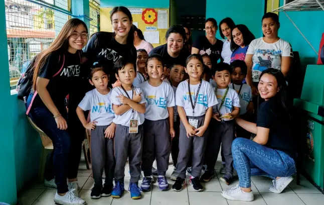  ??  ?? hands-on approach MovEd founder Alex Eduque and her team go out and interact with the children in their learning centres, strengthen­ing the bond between the organisati­on and its target communitie­s