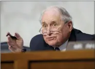  ?? SUSAN WALSH — THE ASSOCIATED PRESS FILE ?? Senate Armed Services Committee Chairman Sen. Carl Levin, D-Mich., asks a question of a witness during a hearing on Capitol Hill in Washington on legislatio­n regarding sexual assaults in the military in 2013.