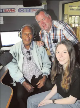  ??  ?? MEMORIES: Ambong Thompson tries headphones on for size during a visit with friend Alistair Cowie to radio station 3WM and MIXX FM studios in Horsham. They are pictured with copywriter Holly King. Picture: DEAN LAWSON