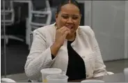  ?? ?? Long Beach first lady Nina Richardson, who has food allergies, tries a gummy at Food Allergy Institute's Long Beach office.