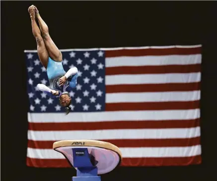  ?? Jeff Roberson photos / Associated Press ?? Simone Biles was a sight to behold on the vault, with her score of 9.9 coming within a tenth of a point of perfection.